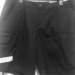 Black Bermuda shorts with tags